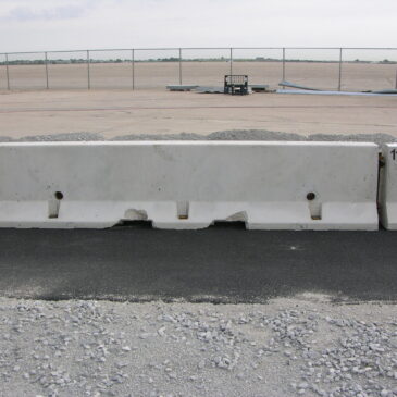 Driven Pins Through Asphalt For F-Shape Concrete Barriers