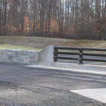Steel-Tube Bridge Railing to Stone-Faced Barrier Transition